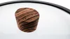 A close-up shot of a wooden knob on a glass lid. Produktbild-Vorschau