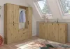 A bedroom or dressing room with wooden furniture and skylights. Produktbild-Vorschau