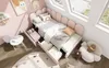 A child's bedroom with a pink bed, toys, and artwork. Podgląd zdjęcia produktu