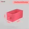 A pink storage box with dimensions indicated by lines and text. Produktbild-Vorschau