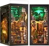 A diorama of a magical workshop or library, with shelves filled with potions, books, and other mystical items, illuminated by green lights. Voir les images du produit