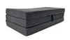 A folded dark gray mattress on a white background. Produktbild-Vorschau