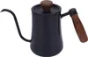 A black gooseneck kettle with a wooden lid and handle is shown against a white background. Podgląd zdjęcia produktu