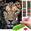 A collage showing a diamond painting kit with a close-up of a tiger's face and the painting supplies. Produktbild-Vorschau