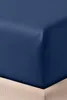 A close-up view of a navy blue fitted sheet draped over a tan mattress. Produktbild-Vorschau