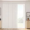 A room interior with a large window covered by light gray panel blinds. Produktbild-Vorschau
