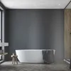A modern bathroom with a freestanding bathtub. Produktbild-Vorschau