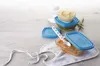 Baby food storage containers and accessories arranged on a light-colored surface. Voir les images du produit