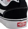 A close-up view of the heel and sole of a black and white Vans sneaker. Voir les images du produit