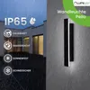 A modern outdoor wall light is shown mounted on a textured wall, with rain falling. Náhľad obrázku produktu
