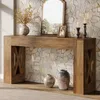 A console table with decorative items in a room with a stone wall. Podgląd zdjęcia produktu