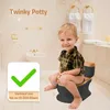 A young child is sitting on a potty in a bathroom. Náhľad obrázku produktu