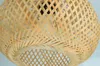 Close-up view of a woven bamboo lampshade. Produktbild-Vorschau
