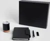 A set of office supplies including a notebook, pen, USB drive, and a mug, arranged on a white background. Náhľad obrázku produktu