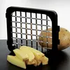 A potato slicer with cut potato pieces and a whole potato. Náhled obrázku produktu