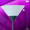 A floor lamp with a large conical shade and a smaller reading light attached to the stem, set against a vibrant purple background with abstract light patterns. Produktbild-Vorschau