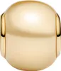 A close-up studio shot of a single gold charm. Podgląd zdjęcia produktu