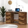 A wooden desk with a laptop and a plant. Anteprima dell’immagine prodotto