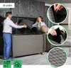 A couple is putting cushions into a large outdoor storage box. Náhľad obrázku produktu