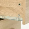 A close-up view of a wooden drawer with metal drawer slides. Voir les images du produit