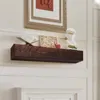 A wooden mantelpiece shelf mounted on a wall, decorated with a book, a framed artwork, a small red apple, and a bust of a classical figure. Produktbild-Vorschau