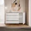 A white chest of drawers with silver accents, placed in a room with modern decor. Produktbild-Vorschau