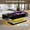 A modern black coffee table with its lift-top open, revealing storage compartments and LED lighting. The table is placed in a living room setting with a sofa in the background. Produktbild-Vorschau