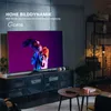 A modern living room setting with a large TV displaying vibrant content, showcasing its HDR capabilities. Produktbild-Vorschau