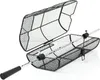 A black mesh grill basket with a silver handle and rotating mechanism, shown open against a white background. Anteprima dell’immagine prodotto