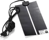 A black reptile heating mat with a white stripe down the center, connected to a black power cord and plug. Anteprima dell’immagine prodotto
