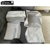 Several fabric storage organizers with a white polka dot pattern are laid out on a gray sofa. Voir les images du produit