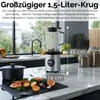 A kitchen counter with a blender, fruits, and jars. Produktbild-Vorschau