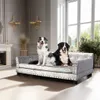 Two dogs are sitting on a luxurious pet sofa in a well-decorated room with large windows. Náhled obrázku produktu