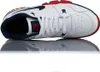 A top-down view of a white Nike cross-trainer shoe with navy and red accents, reflected on a white surface. Náhled obrázku produktu