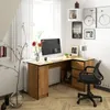 A home office setup with a corner desk, computer, and decorative items. Produktbild-Vorschau