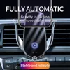 A car's dashboard with a phone mount and wireless charger attached. Produktbild-Vorschau
