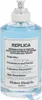 A bottle of Maison Margiela Replica Sailing Day Eau de Toilette. Voir les images du produit