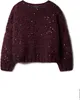 A burgundy knitted sweater with silver sequins, displayed on a white background. Produktbild-Vorschau