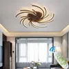 A modern living room with a ceiling light and a remote control. Anteprima dell’immagine prodotto