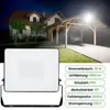 A house with a carport at night, illuminated by a floodlight. A separate image of the floodlight is shown in the foreground. Náhled obrázku produktu