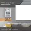 A marketing image showing an infrared heater mounted on a wall above a sofa, with mounting accessories displayed separately. Produktbild-Vorschau