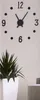 A wall clock with black hands and numbers on a white background, with a potted plant in the foreground. Náhled obrázku produktu