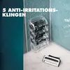 Razor blades stacked in ice, with one blade in the foreground. Produktbild-Vorschau