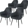 A set of four gray velvet dining chairs with black legs are arranged on a white background. Náhled obrázku produktu
