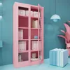 A pink metal cabinet with glass doors filled with office supplies. Produktbild-Vorschau