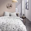 A bedroom scene with a bed, pillows, and decorative items. Produktbild-Vorschau