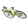 A miniature green bicycle model is displayed against a white background. Produktbild-Vorschau