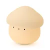 A cute mushroom-shaped night light with a simple face. Podgląd zdjęcia produktu