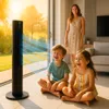 A family enjoying the cooling effect of a tower fan on a sunny day. Podgląd zdjęcia produktu