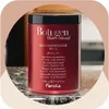 A close-up shot of a red hair mask container with black lid. Anteprima dell’immagine prodotto